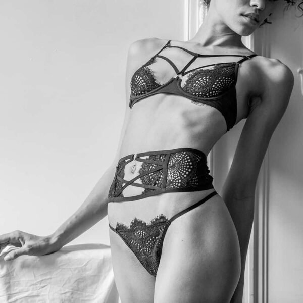 Round black lace lingerie set with g-string and half-open bra with cross-over bra and cross-over suspender belt Atelier Amour at Brigade Mondaine