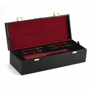 Trunk d'BDSM bondage accessories in burgundy red leather with gold plated finish UPKO