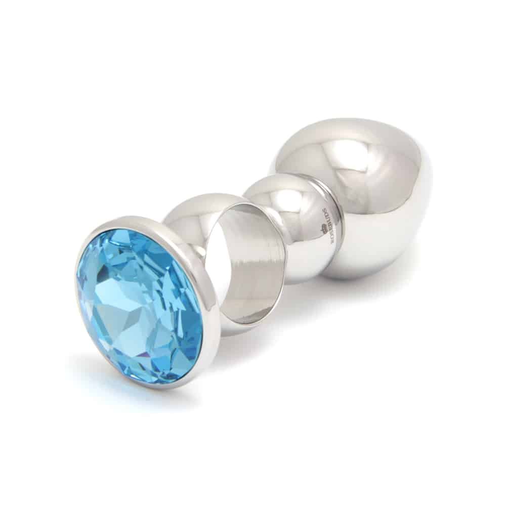 Tapón anal ROSEBUDS de acero inoxidable con anillo y piedra de cristal azul en Brigade Mondaine