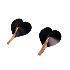 Pasties by Elif Domanic. These Pasties are made of black leather in the shape of a heart with a pompom hanging from the top of each piece in rigid gold-coloured thread. Black stitching is also present on the product.