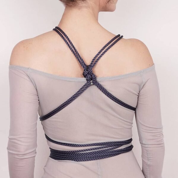 Based on FOA's iconic revision of the Japanese art of rope bondage, the super versatile Torso Knot Harness is as unique and different as you can imagine. With a "hishi" patterned base structure of soft polyester rope and brass and bronze colored zinc alloy hardware, our new harness offers an extra length of loose rope allowing you to enjoy the creativity and versatility of completing the harness in your own designs. With the Self-Tie, you get several different harnesses all in one. The Self-Tie is adjustable to any size and will come with easy to follow instructions showing the two main variations of harness attachment. Available from Brigade Mondaine.
