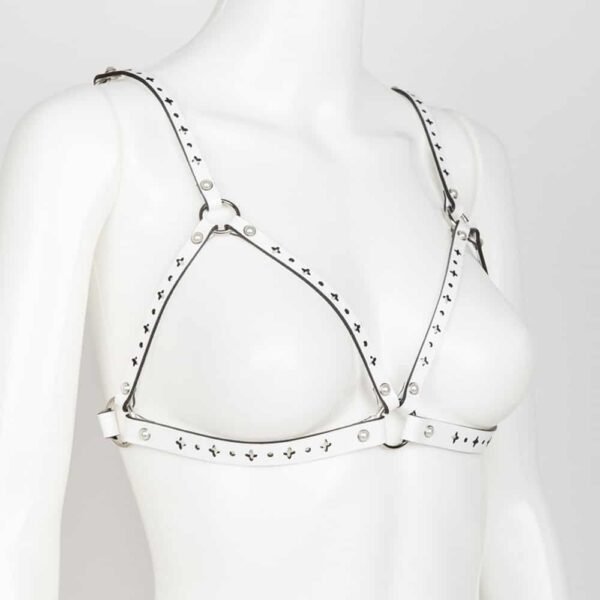 Bianco White Fräulein Kink Open Bra on Brigade Mondaine, made entirely by hand and to order in the brand's Berlin workshops from laser-cut patent leather with high-quality pearl rivets, the Bianco Open Bra is meant to be a trendy lingerie piece or accessory like a bust harness. Wear this glamorous bra over your favorite silk blouse, dress or directly on the skin. A perfect accessory for inside or outside the bedroom.Double cap rivets ringed in ivory pearl silver. Adjustable double-sided white satin elastic straps. Adjustable stretch back hook closure.