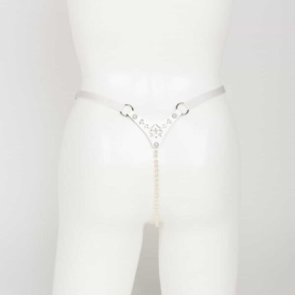 Bianco White Pearl Thong Fräulein Kink on Brigade Mondaine, made entirely by hand and to order in Berlin, in the brand's workshops, from laser-cut white leather and ivory pearl rivets; The Bianco Pearl Thong is designed to be seen. Chic & Seductive! The center string features a luxurious strand of ivory glass beads and adjustable double-sided satin elastic for easy waist adjustment. Guaranteed to stimulate your senses! Custom laser-cut white patent leather. Ivory glass beaded center chain. Adjustable double-sided satin elastic for easy waist adjustment. Double-capped rivets with ivory pearl silver rims.